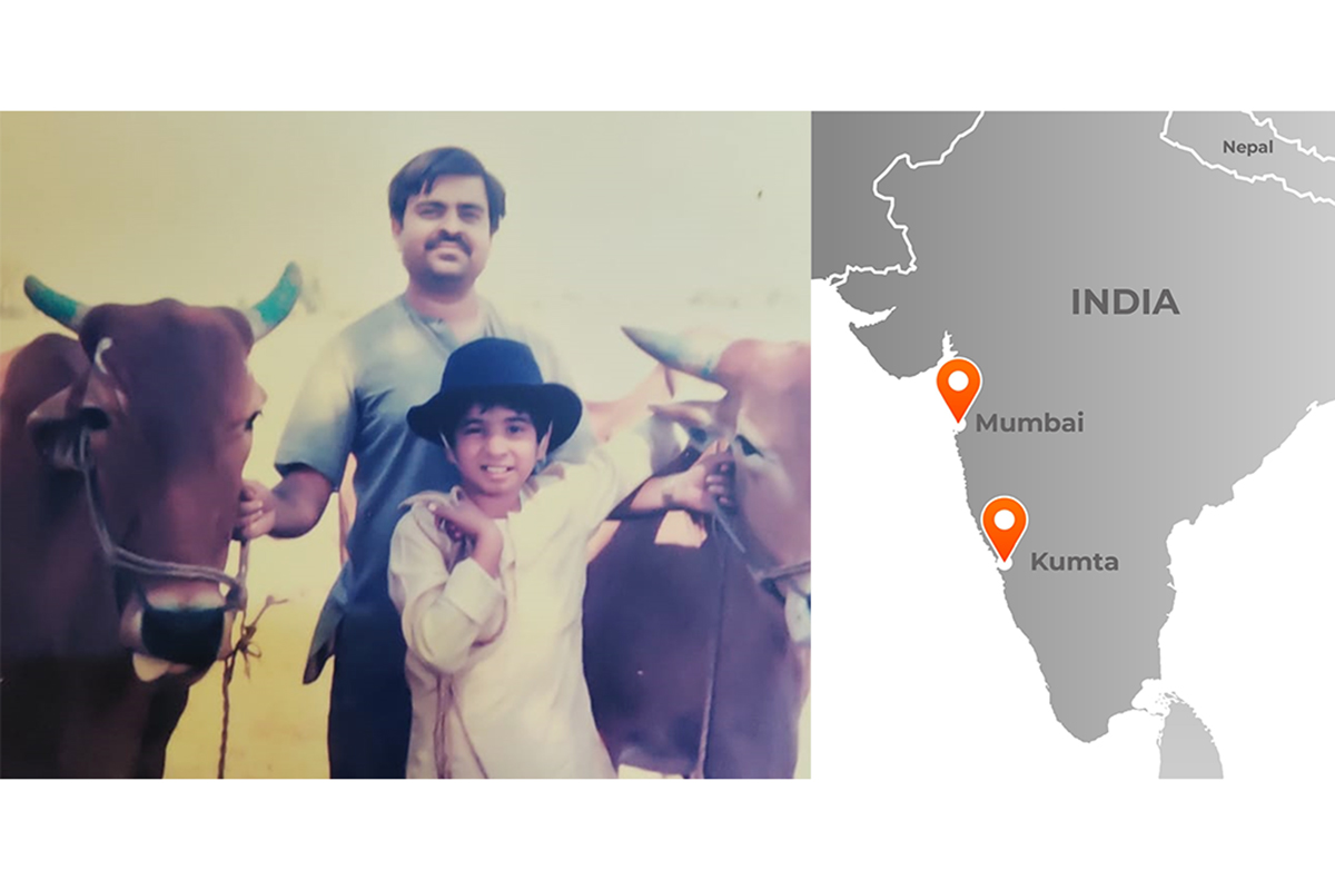 Girish Chowdhary, foreground, and his father, Vinayak Chowdhary, with their oxen Dhavalya and Povalya. (Photo courtesy: Illinois News Bureau, Girish Chowdhary and map by Michael B. Vincent)