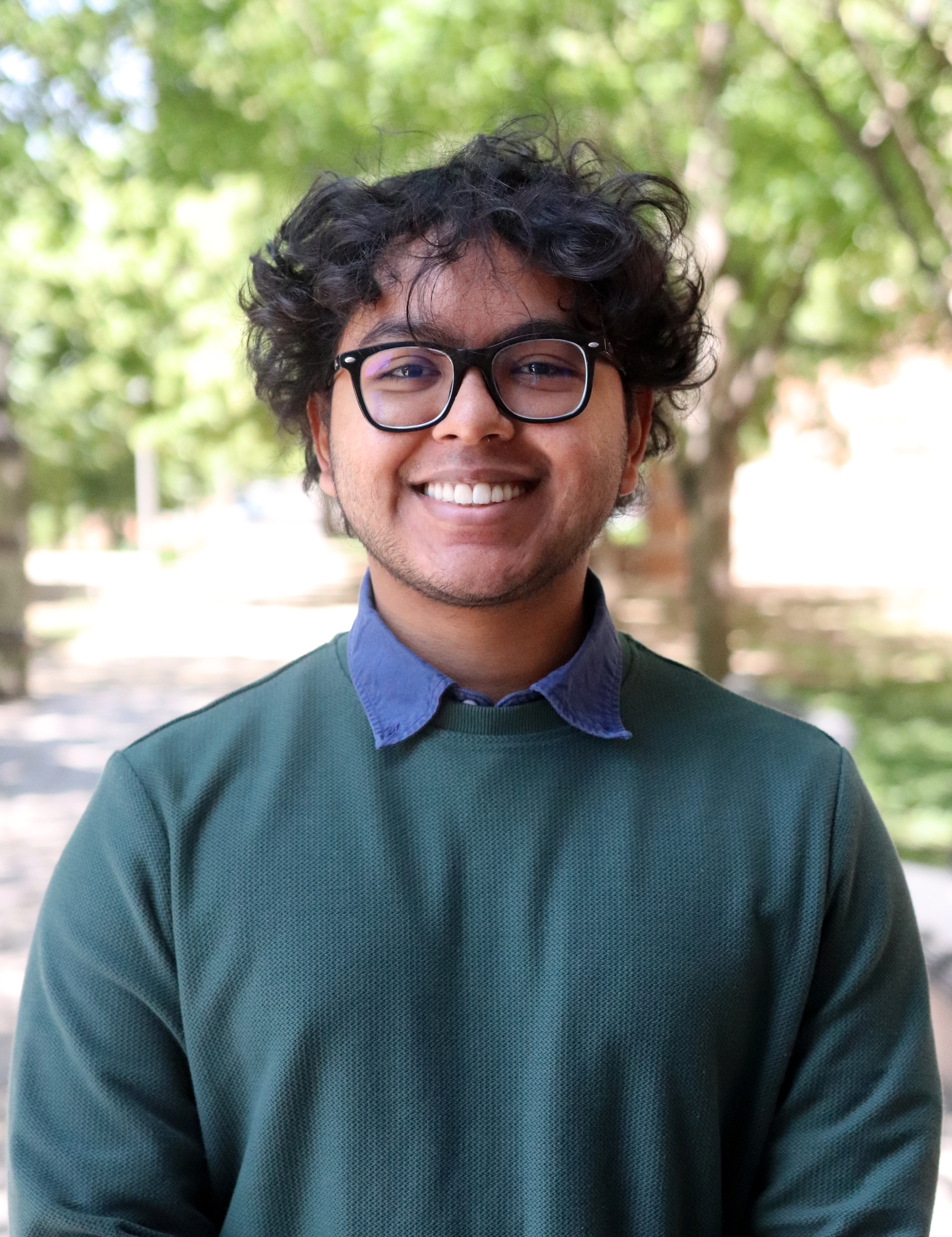 professional headshot of Aman Saji