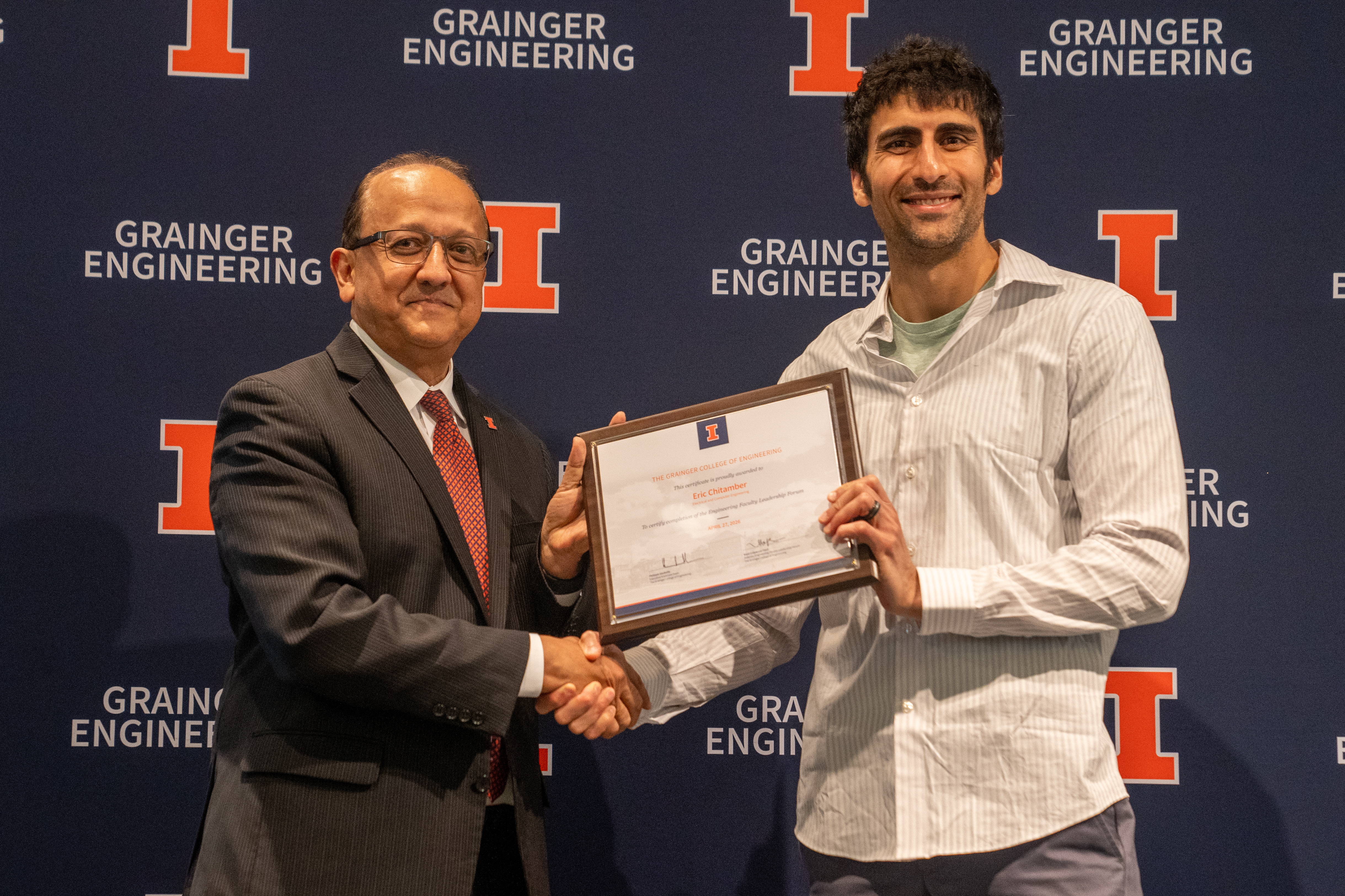 Dean Rashid Bashir presents Professor Eric Chitambar with certificate