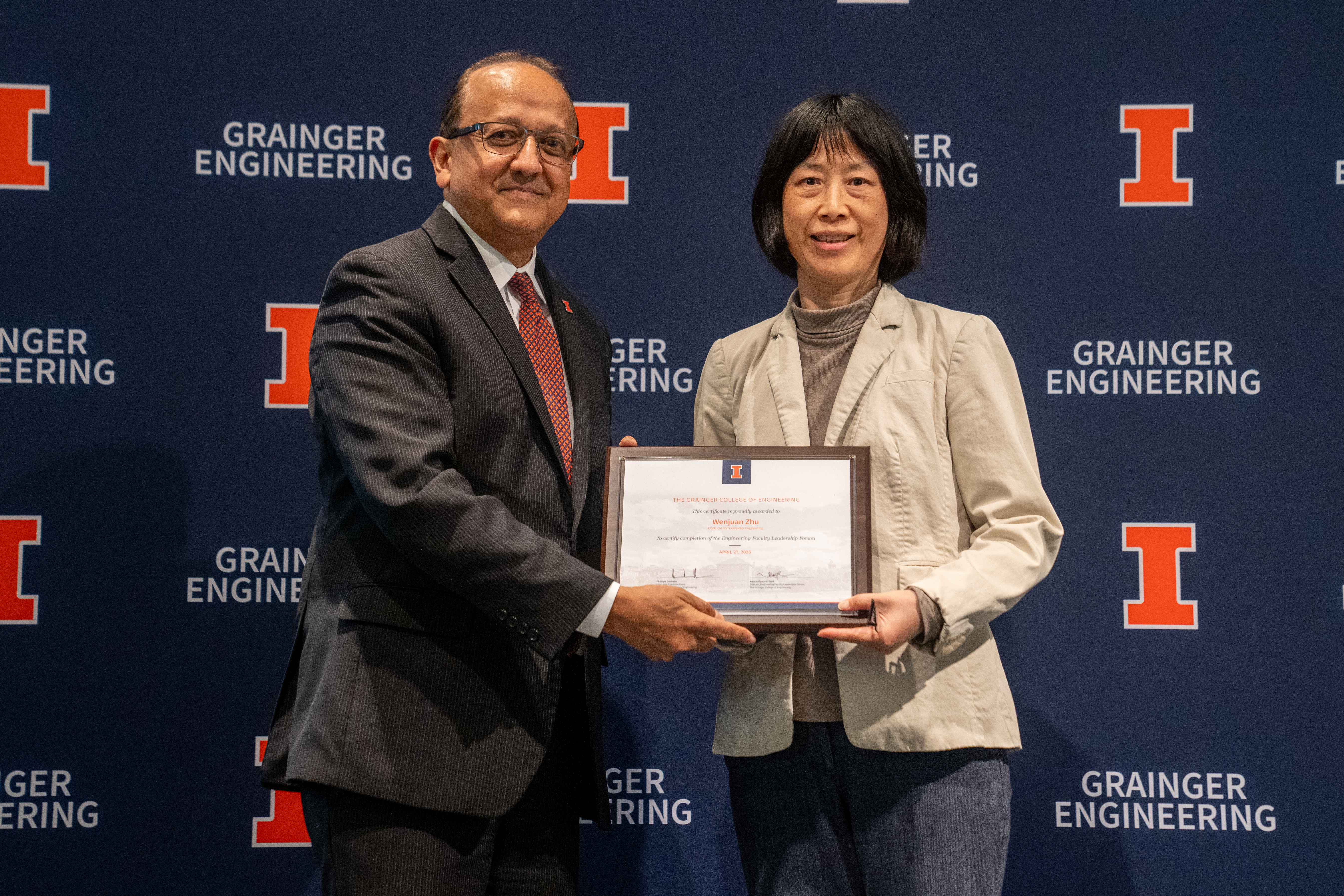 Dean Rashid Bashir presents Professor Wenjuan Zhu with certificate