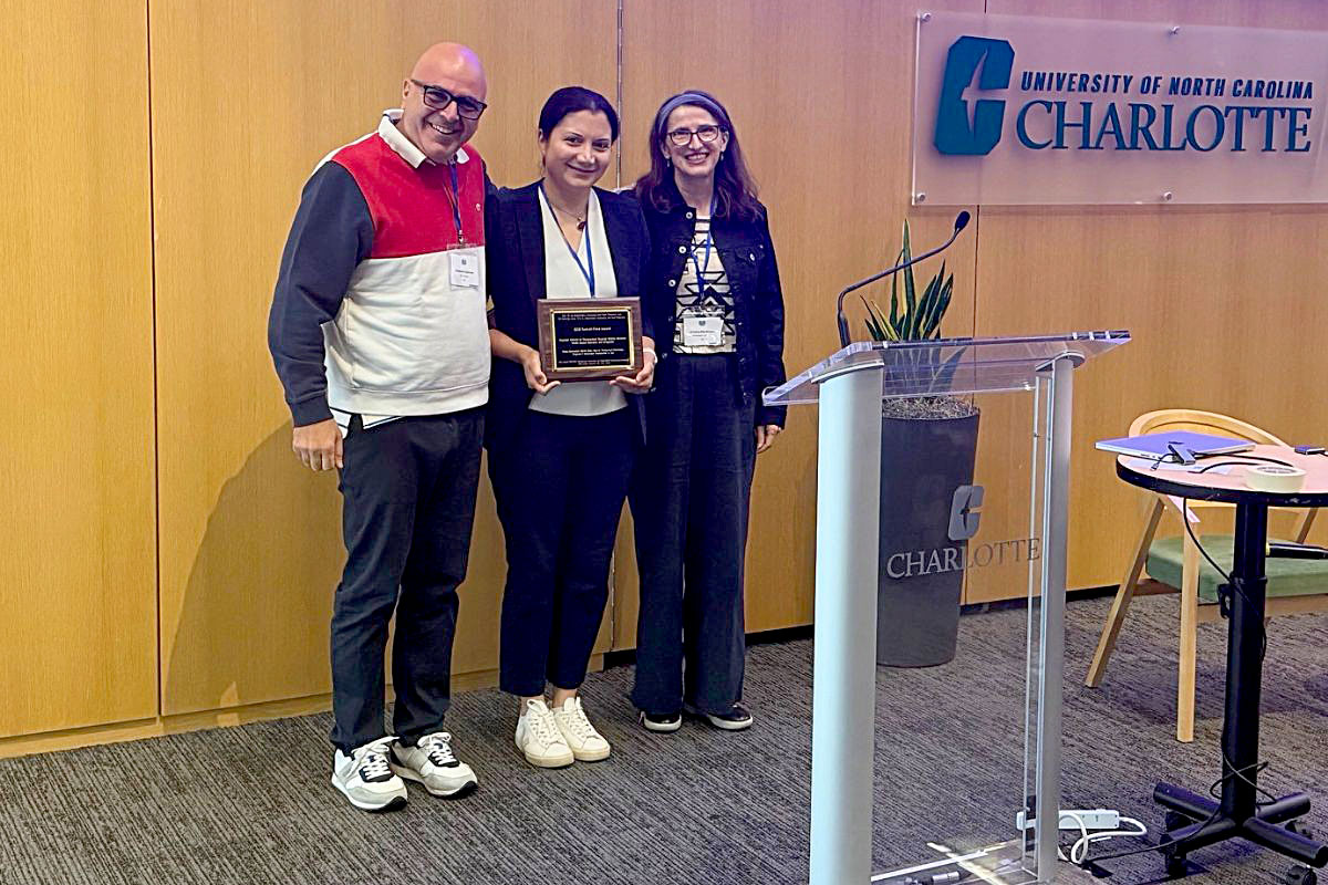 Lead author Homa Alemzadeh (center), now at the University of Virginia, accepts the DSN 2026 Test of Time Award at the 56th Annual IEEE/IFIP International Conference on Dependable Systems and Networks in Charlotte, North Carolina, in June. [Photo courtesy of Homa Alemzadeh.]