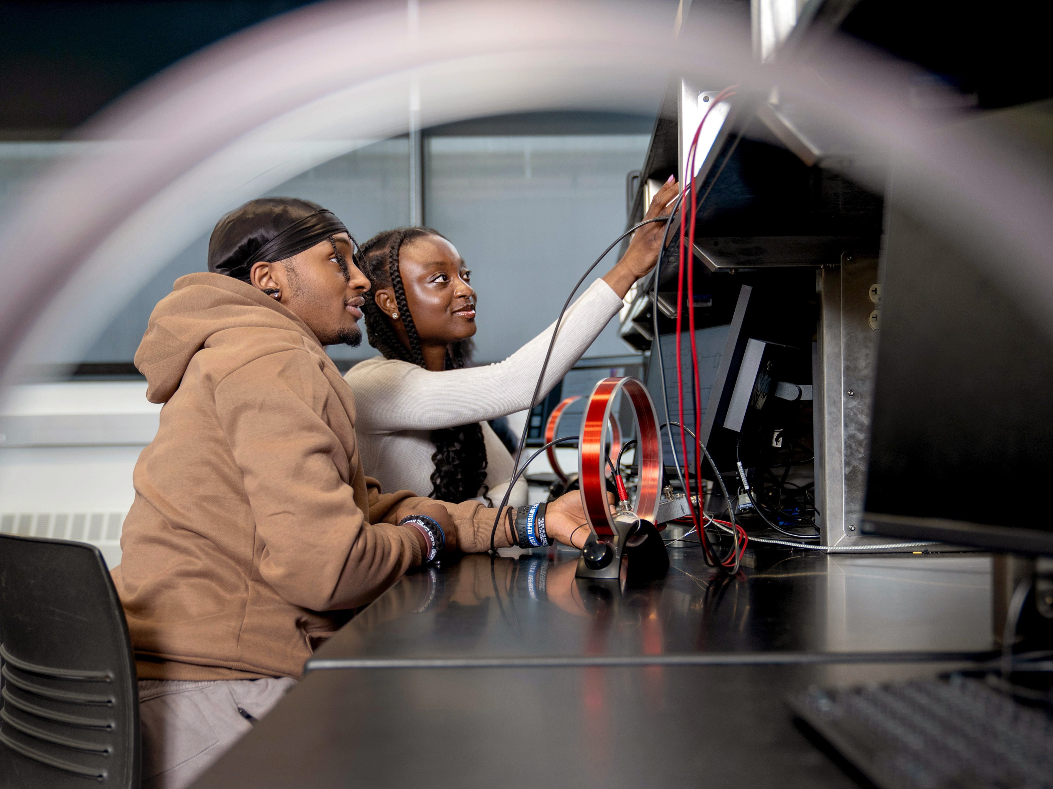 two students working in an ECEB lab room