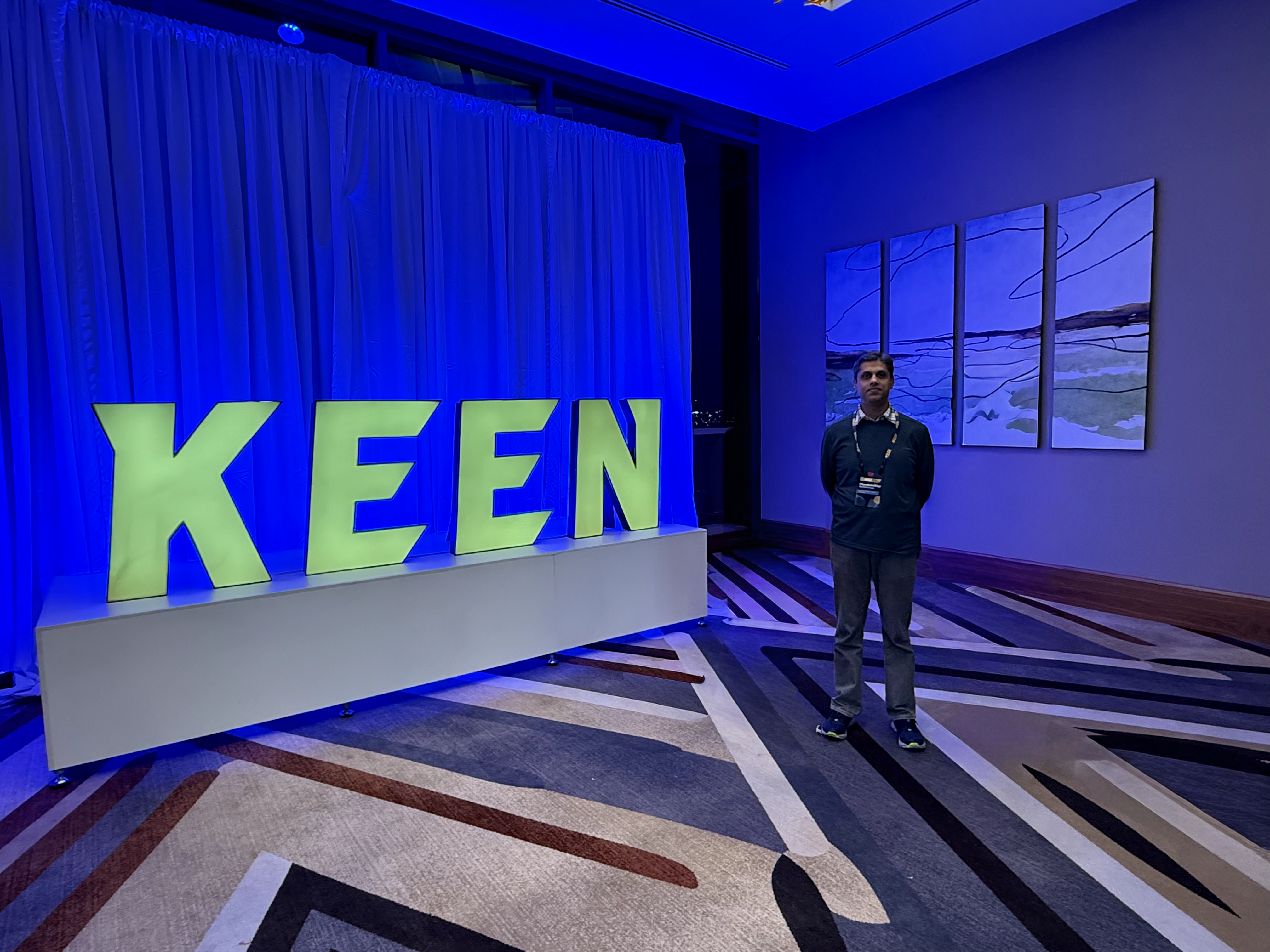 Chandrasekhar Radhakrishnan alongside the KEEN logo