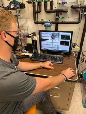 Kevin Pikul working on the VCSEL research inside Holonyak Lab