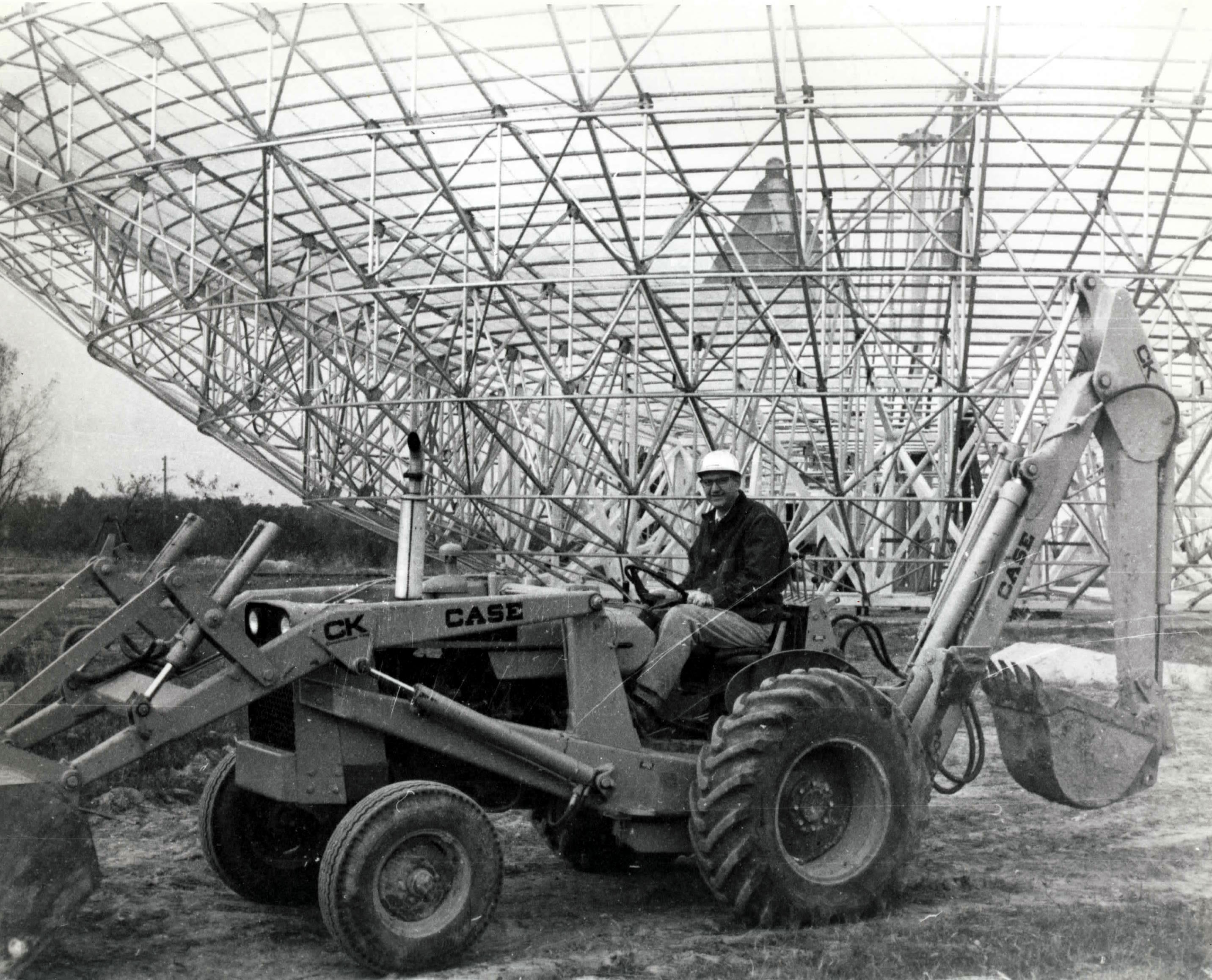 Swenson next to the construction of the radio telescope
