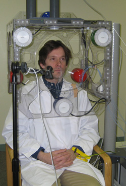 ECE Associate Professor Mark Hasegawa-Johnson demonstrates an articulograph, a device that measures parts of the face and mouth in order to better understand the mechanics of speech.