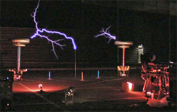 Mark Smart (far right) plays the Continuum Fingerboard as the Tesla coils fire behind him.