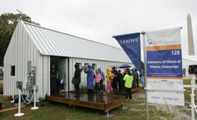 Visitors braved the rain to visit the Solar Decathlon houses. Photo by Stefano Paltera/U.S. Department of Energy Solar Decathlon.