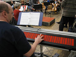 Mark Smart performs on the Continuum Fingerboard during a recent rehearsal of the Champaign-Urbana Symphony Orchestra.