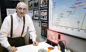 Nick Holonyak Jr. in his office at the Micro and Nanotechnology Laboratory. The chart to the right illustrates the LED's developmental timeline.