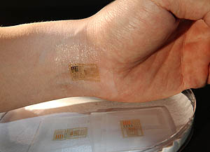 An ultrathin, electronic patch with the mechanics of skin, applied to the wrist for EMG and other measurements. Photo courtesy John Rogers.