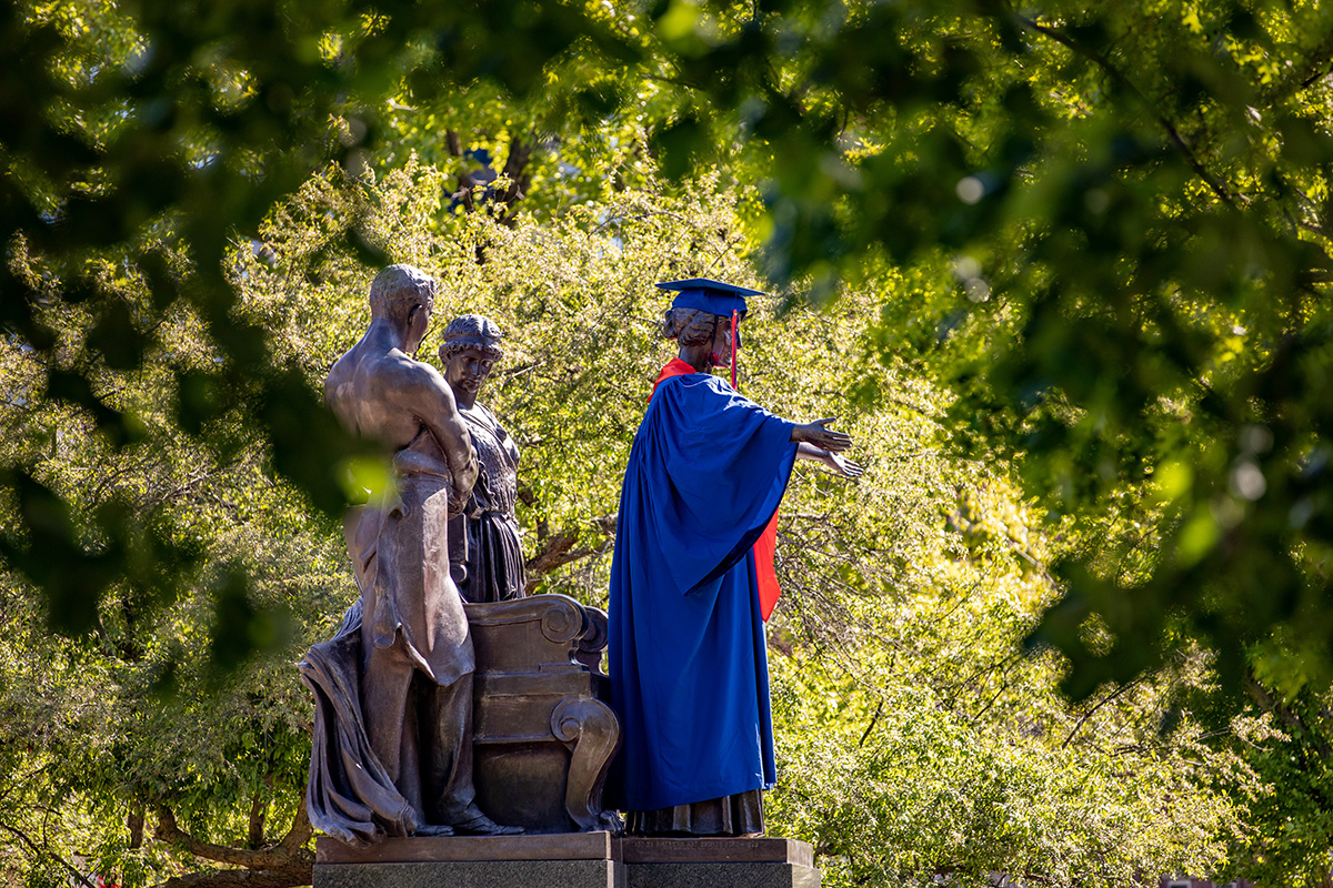 The iconic Alma Mater statue figuratively bade farewell to more than 9,000 graduates in May. Photo by Fred Zwicky