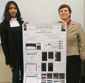 Anjali Sridhar (left) and Computer Science Proessor Klara Nahrstedt hold the poster they also presented at the 2011 EdMedia conference on their Mi-Clicker project.