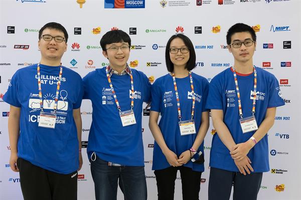 Illinois team, &quot;Must Pass,&quot; at the 2021 International Collegiate Programming Contest World Finals in Moscow with co-coach Peiyao Sheng (second from right)
