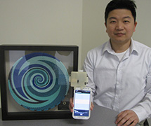 Assistant Professor Liu with the MoboSens sensor and Vodafone award. Liu and the MoboSens team were recognized at the Vodafone Wireless Innovation Project awards ceremony and Global Philanthropy Forum at Silicon Valley on April 16. 