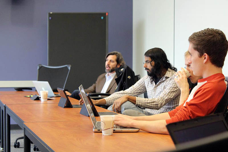 Members of the second cohort in Illinois' I-Corps Sites program meet to discuss the status of their projects. Photo by Arjun Fadnis.