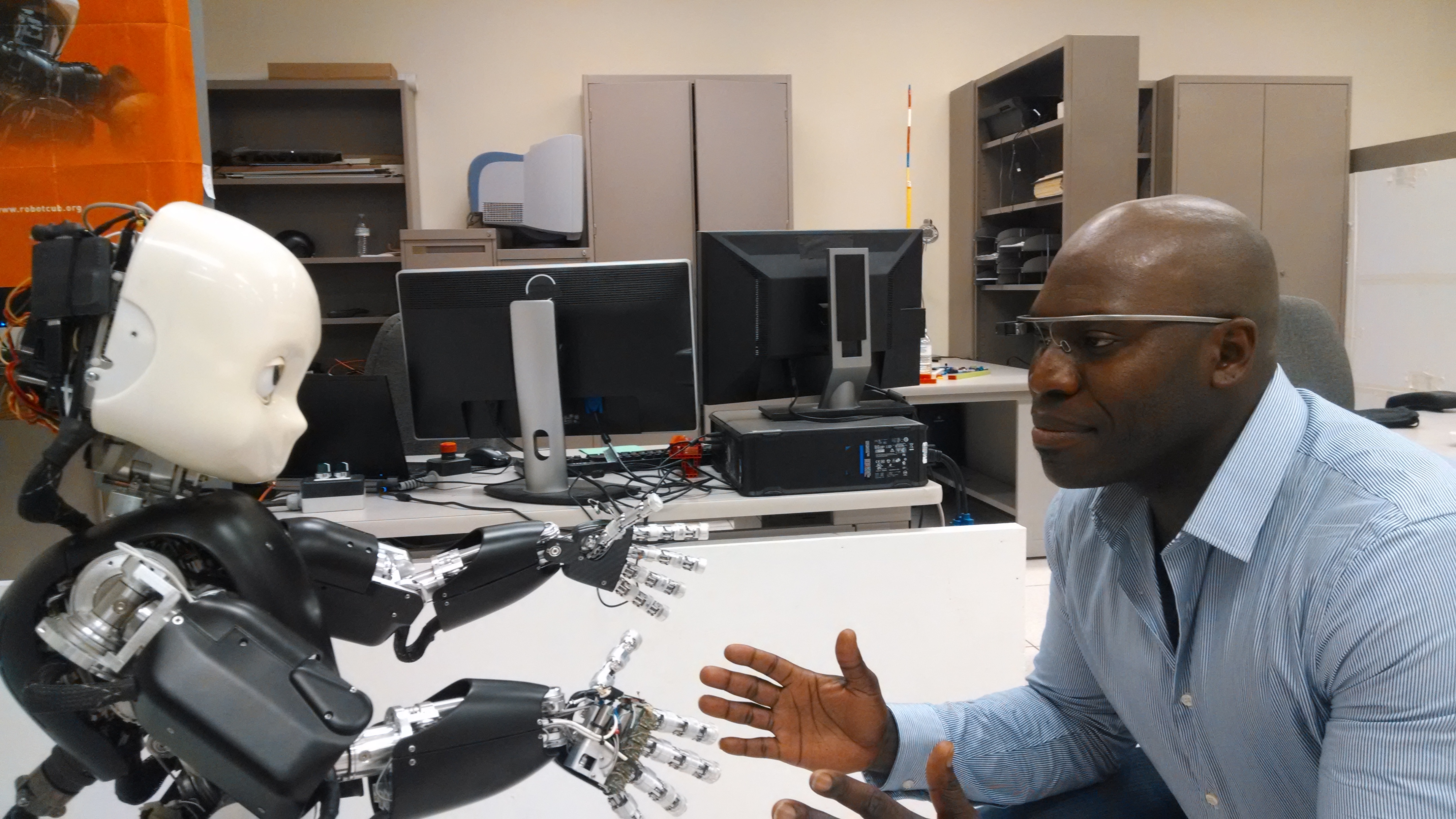 Osuagwu at the Language Acquisition and Robotics Lab with the iCub humanoid robot. Photo credit: Junia Findlay, ECE ILLINOIS. 