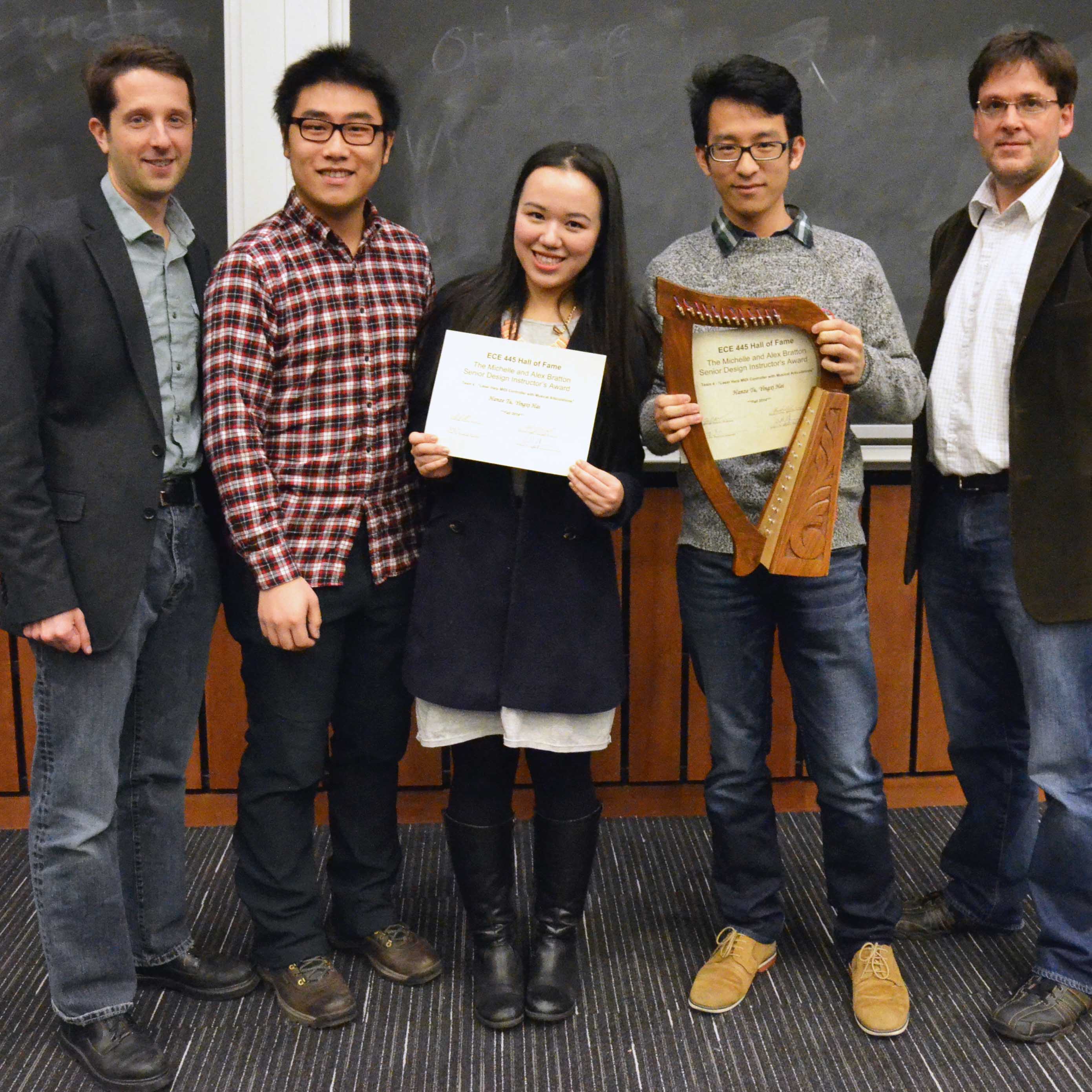 From left, Professor Johnathan Makela, Senior Design teaching assistant Yang Xu, Bratton Senior Design Instructor's Award winners Yingxi Hai and Hanze Tu, and Associate Professor Michael Oelze. 