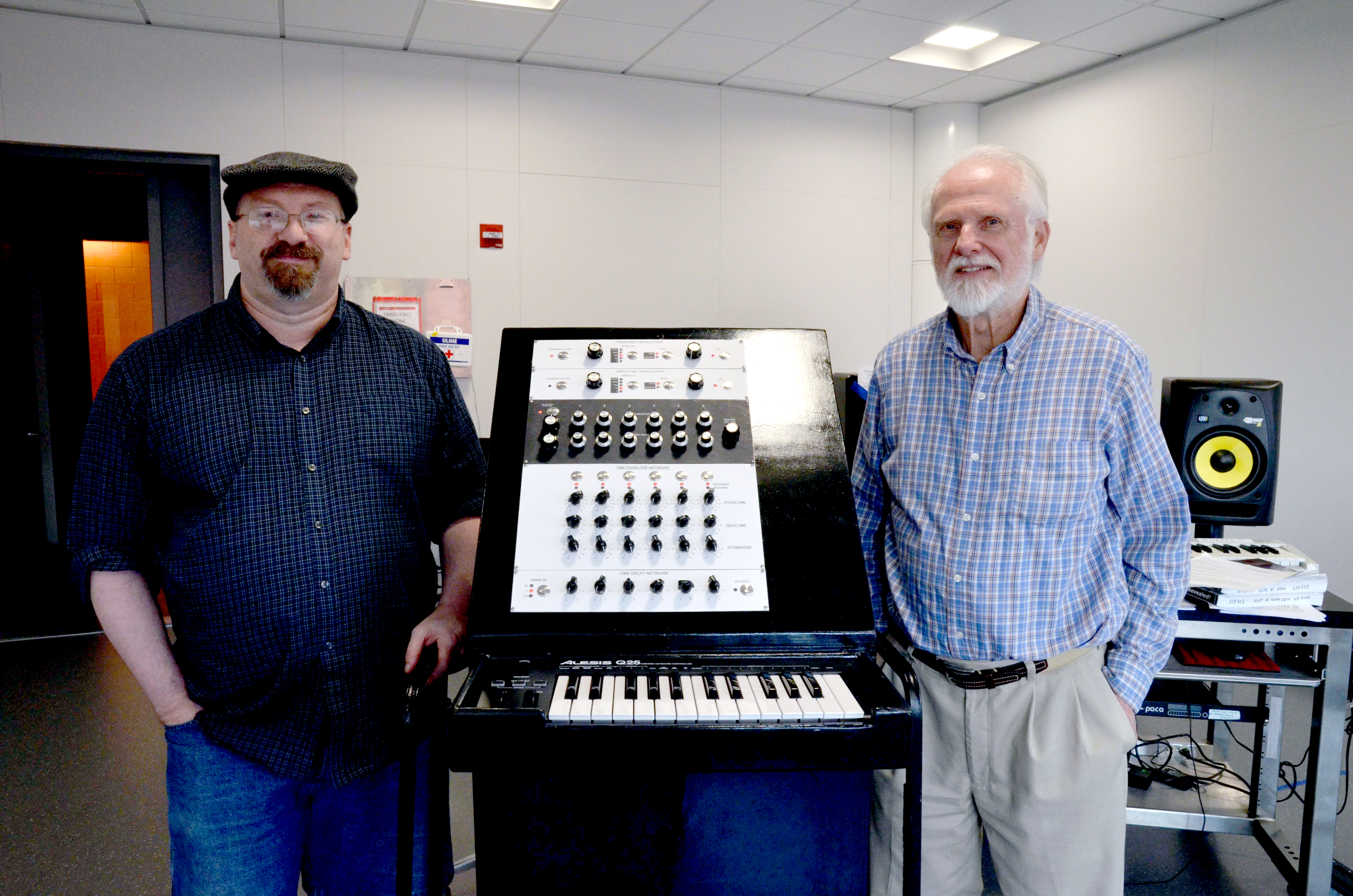 Smart (left) and Beauchamp (right) with the recreated instrument in ECE ILLINOIS' Electronic Music Lab.