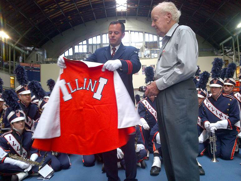 Nearing is presented a Marching Illini cape by Houser