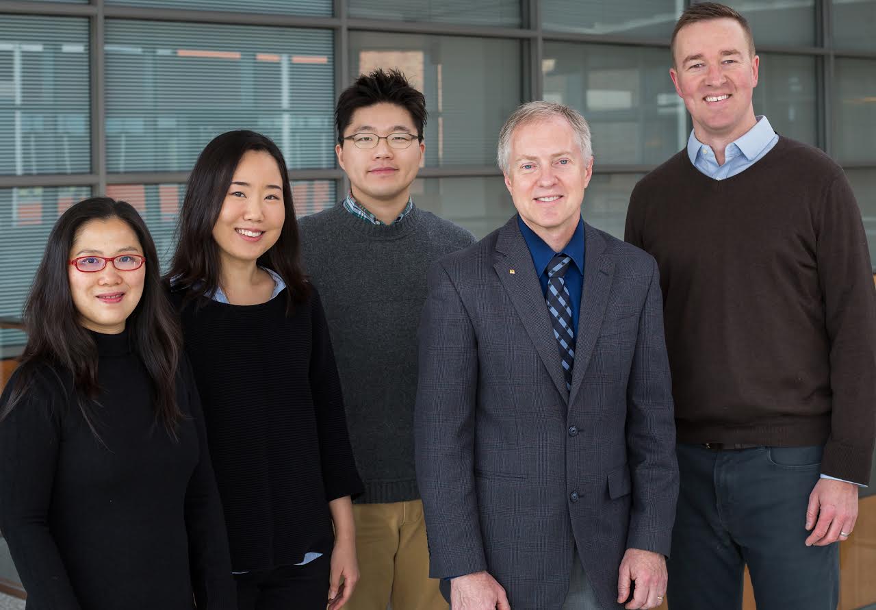 The Illinois research team that created the new photonic crystal enhanced microscope include: (left to right) Yue Zhuo, Ji Sun Choi, Hojeong Yu, Brian T Cunningham, and Brendan A Harley.