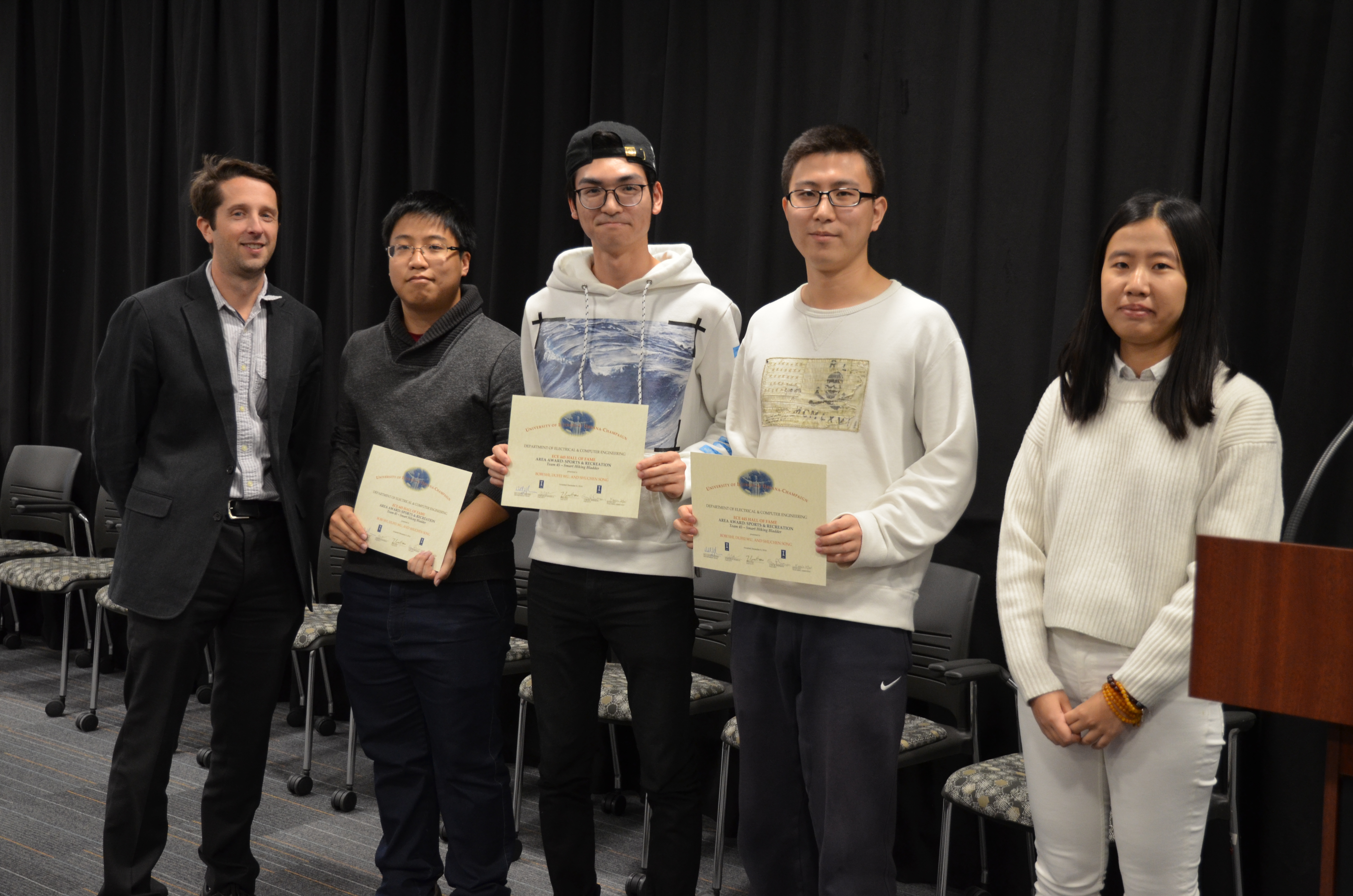 Team 45 won the Area Award for Sports and Recreation for their project 'Smart Hiking Bladder.' Team members: Bobi Shi, Dufei Wu, and Shuchen Song. Also pictured: Kexin Hui (TA) and Professor Makela.