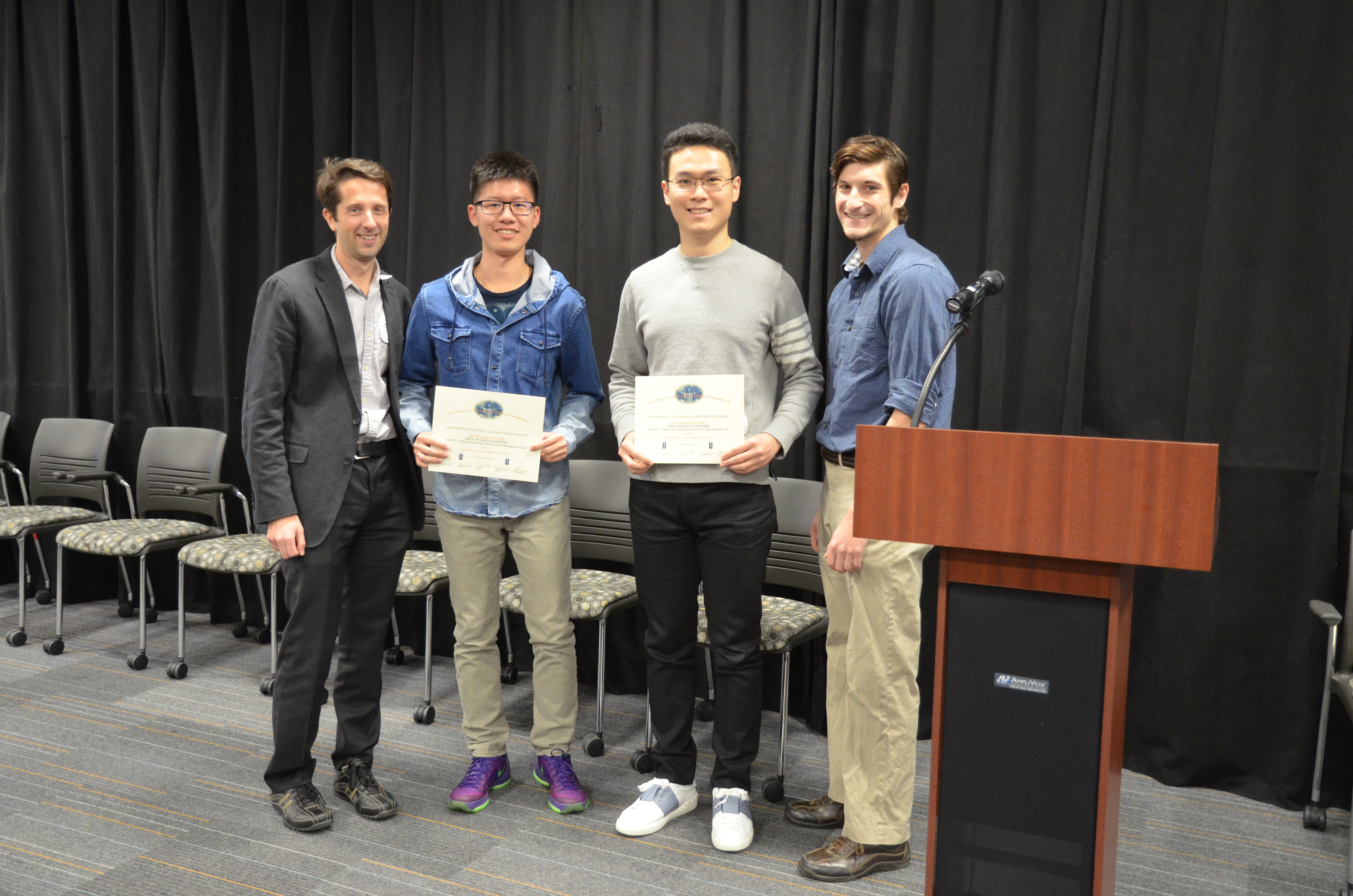 Team 11 won the Area Award for Teamwork for their design of 'Enhanced Security Rotary Pattern Recognition Lock.' Team members: Jingjing Li and Taiming Zhang. Also pictured: John Capozzo (TA) and Professor Makela.