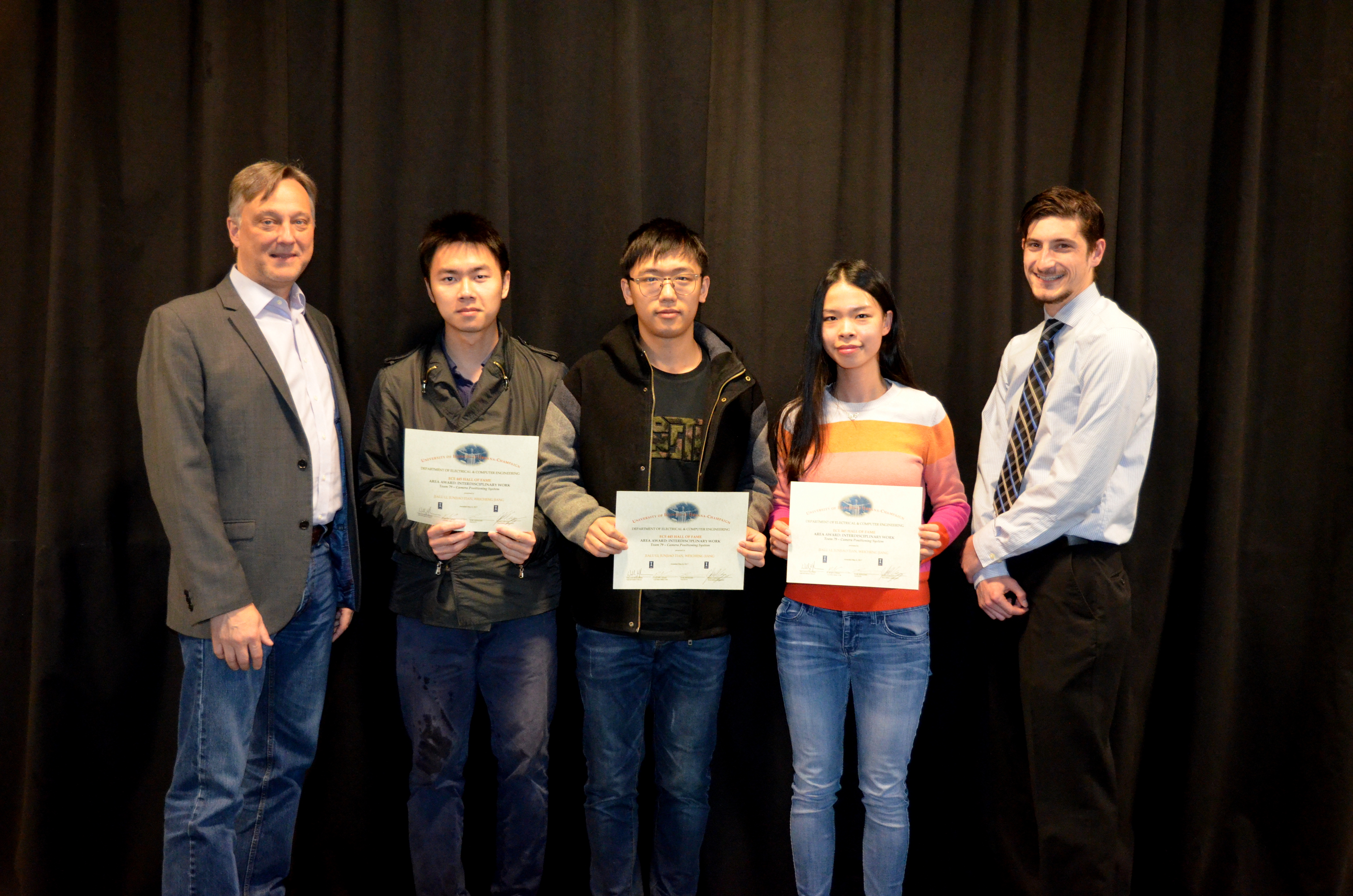 The Area Award for Interdisciplinary Work is awarded to JunJiao Tian, Weicheng Jiang and Jialu li for their 'Camera Positioning System.' Also pictured: Professor Hutchinson, John Capozzo (TA).