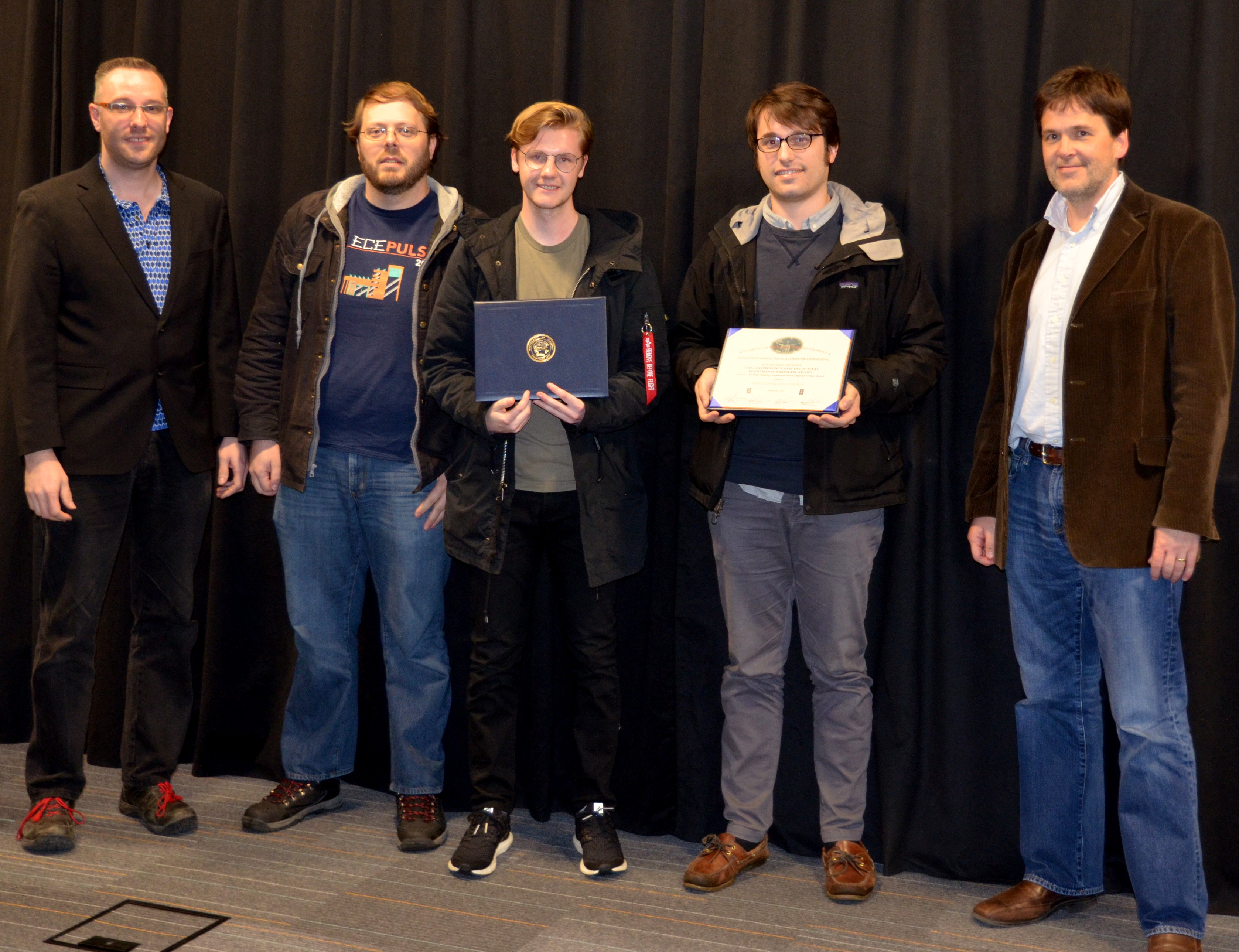 Texas Instrument's Best Use of Texas Instruments Hardware Award is awarded to Justin Sconza and Kyle Vondrak for their 'Step Analog Sequencer with Digital Tempo Input.' Also pictured: Skot Wiedmann (Sponsor), Professor Oelze. 