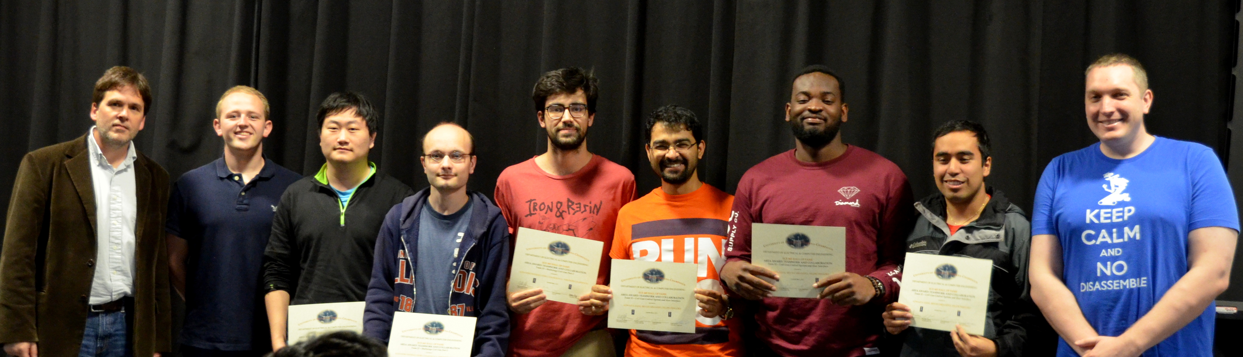 The Area Award for Teamwork and Collaboration is presented to two teams. Alejandro Otero, Changkun Li, and Theodore Culbertson for their 'Multistage Coil Gun Part 2,' and Adwaita Dani, Bryan Mbanefo, and Felipe Fregoso for their 'Coil Gun Control System and User Interface.' Also pictured: Professor Oelze, Jackson Lenz (TA), Luke Wendt (TA).