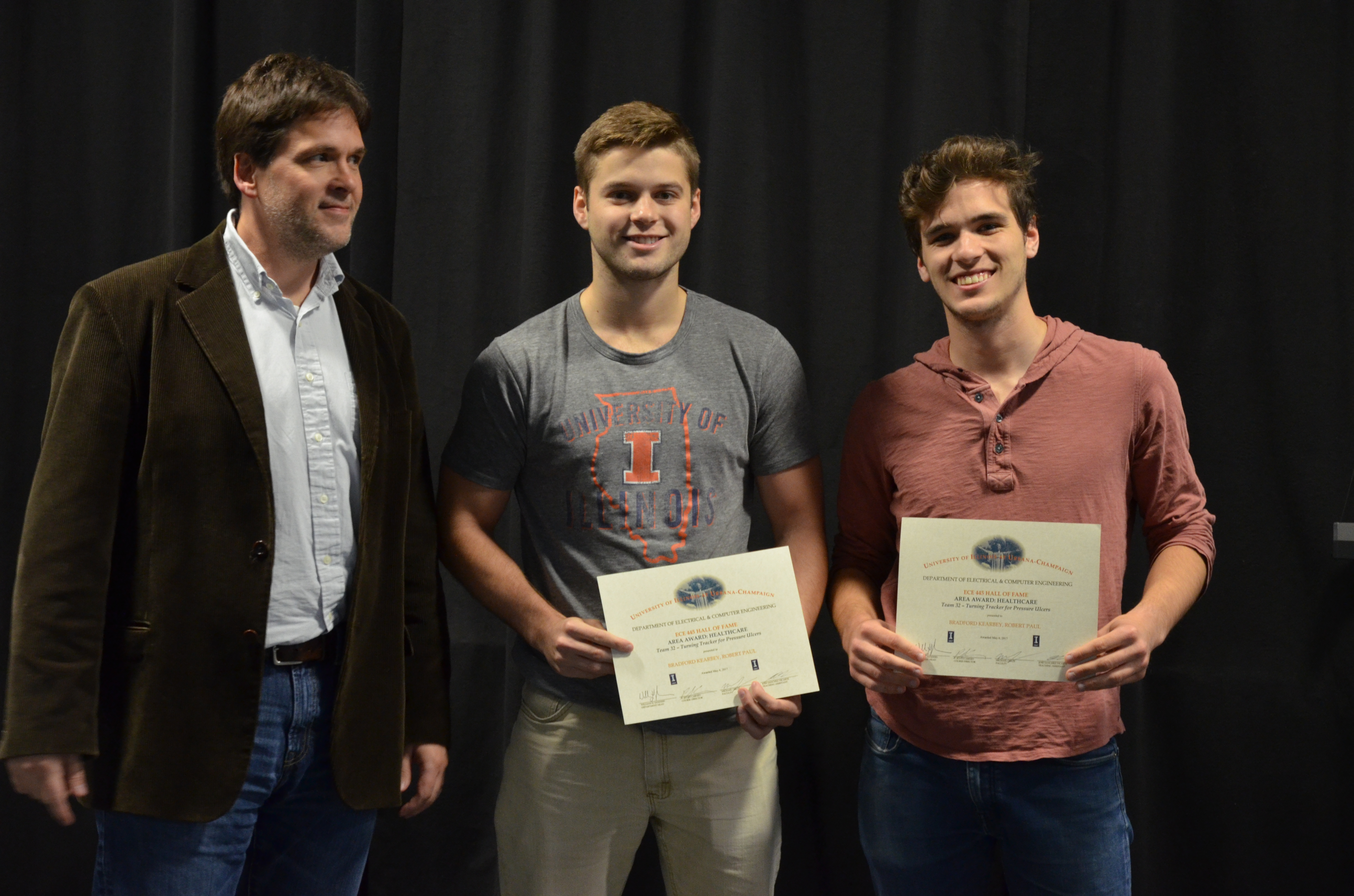 The Area Award for Healthcare was given to Robert Paul and Bradford Kearby for their 'Turning Tracker for Pressure Ulcers.' Also pictured: Professor Oelze.