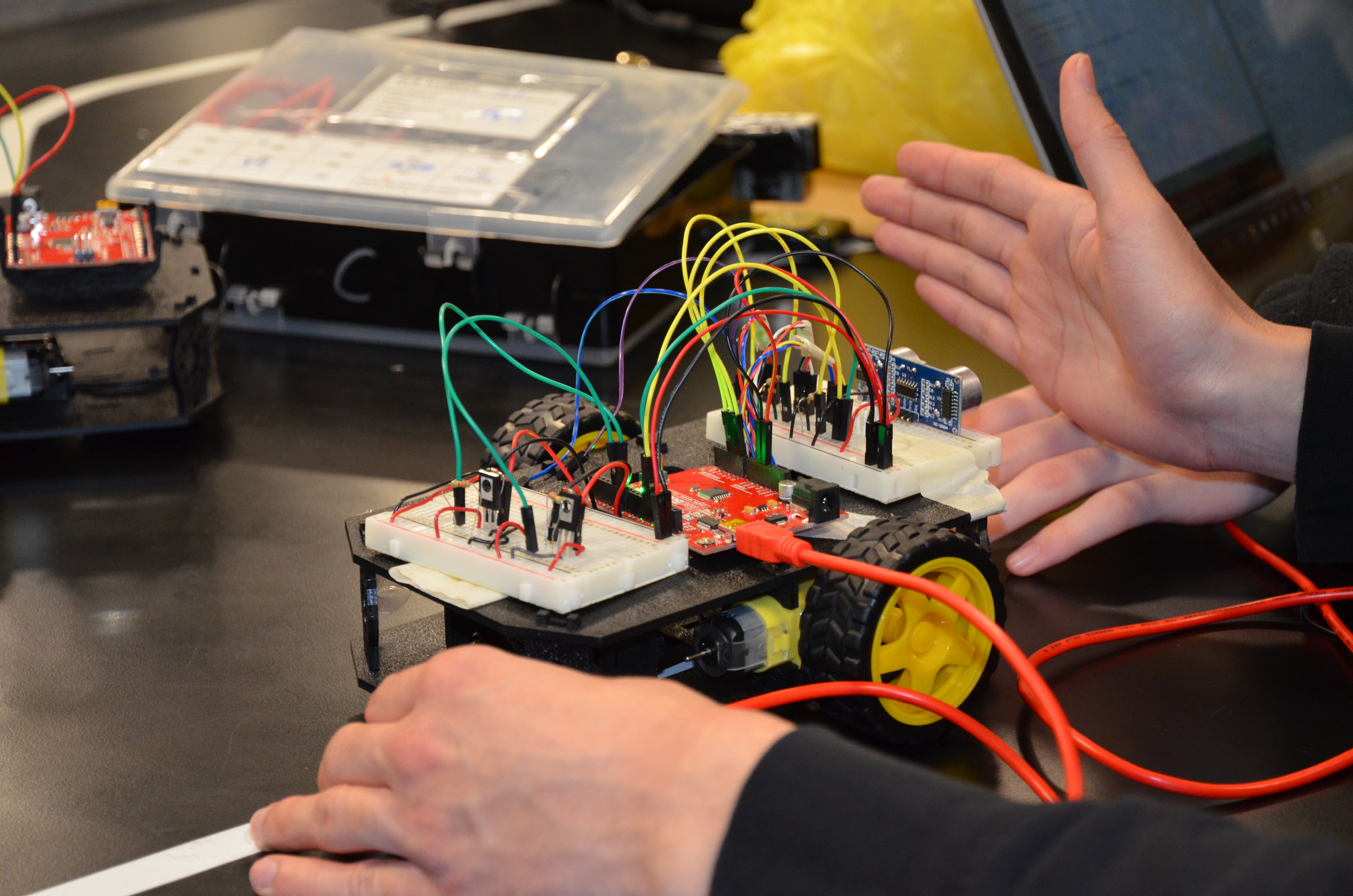 A student demonstrates a project in the Texas Instruments Electronics Design Lab.