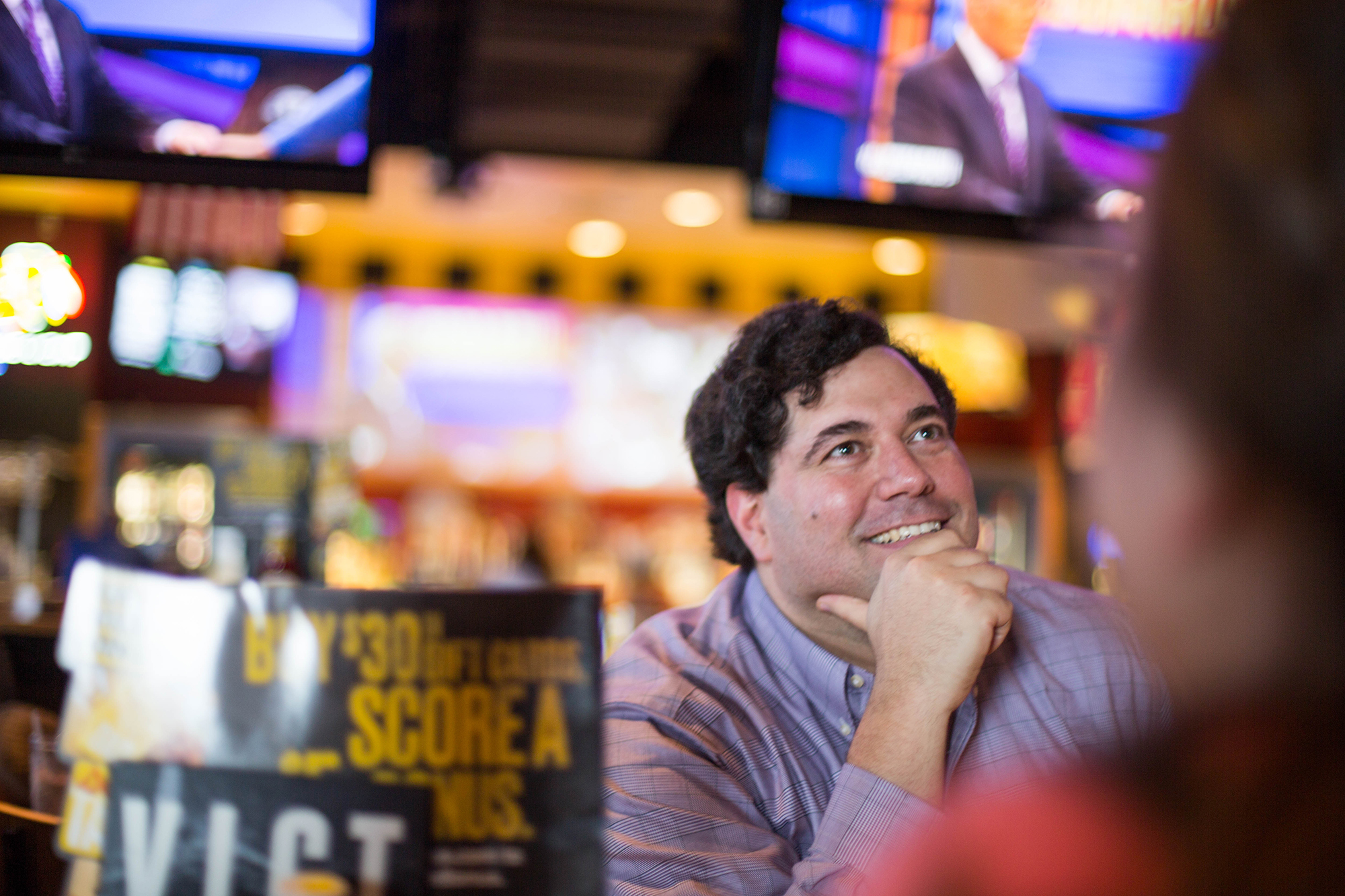 Sam Spencer watches the show with friends at a viewing party.