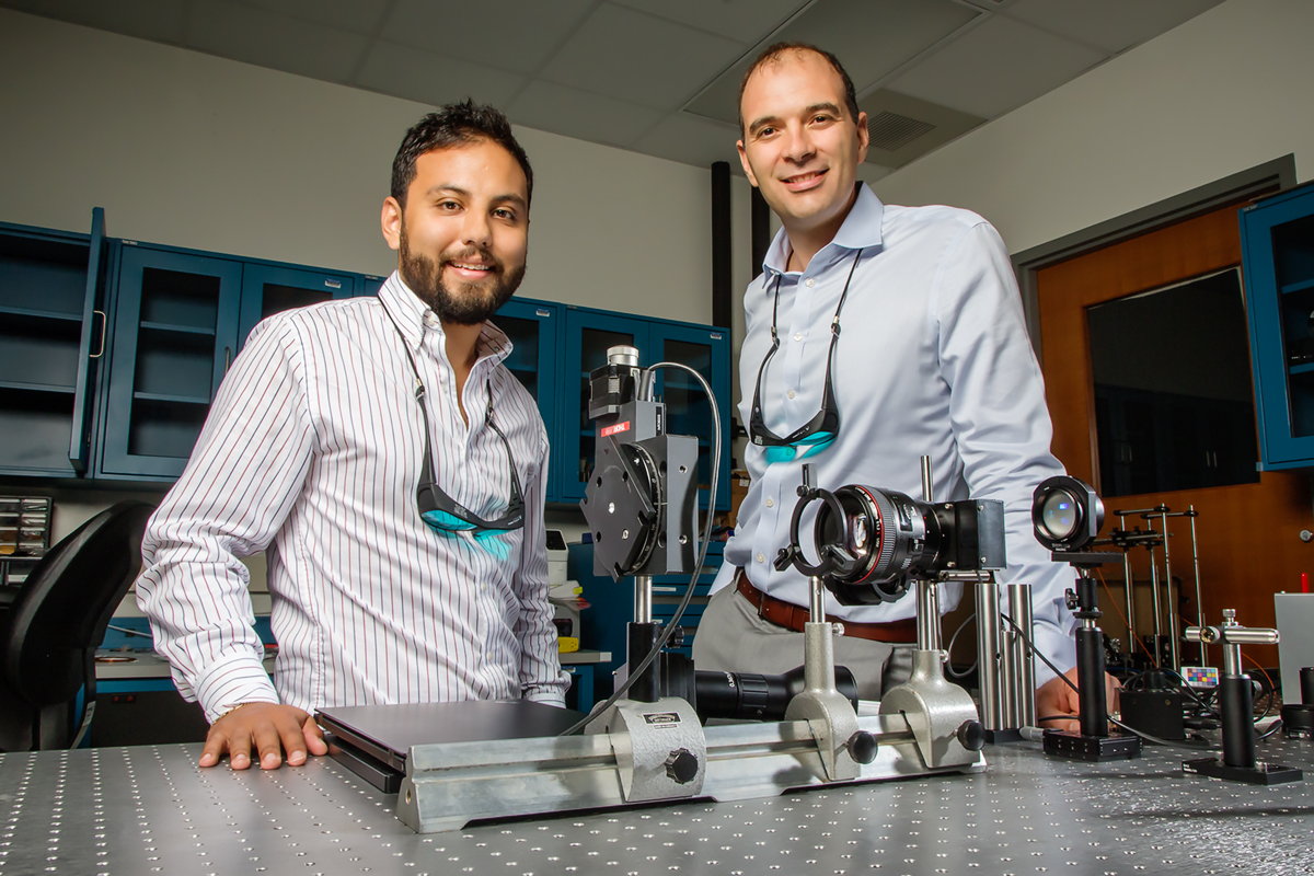 Illinois electrical and computer engineering professor Viktor Gruev, right, and graduate student Missael Garcia have developed a camera capable of sensing both color and polarization by mimicking the eye of the mantis shrimp that may improve early cancer detection and provide new understanding of underwater phenomena. 
Photo by L. Brian Stauffer