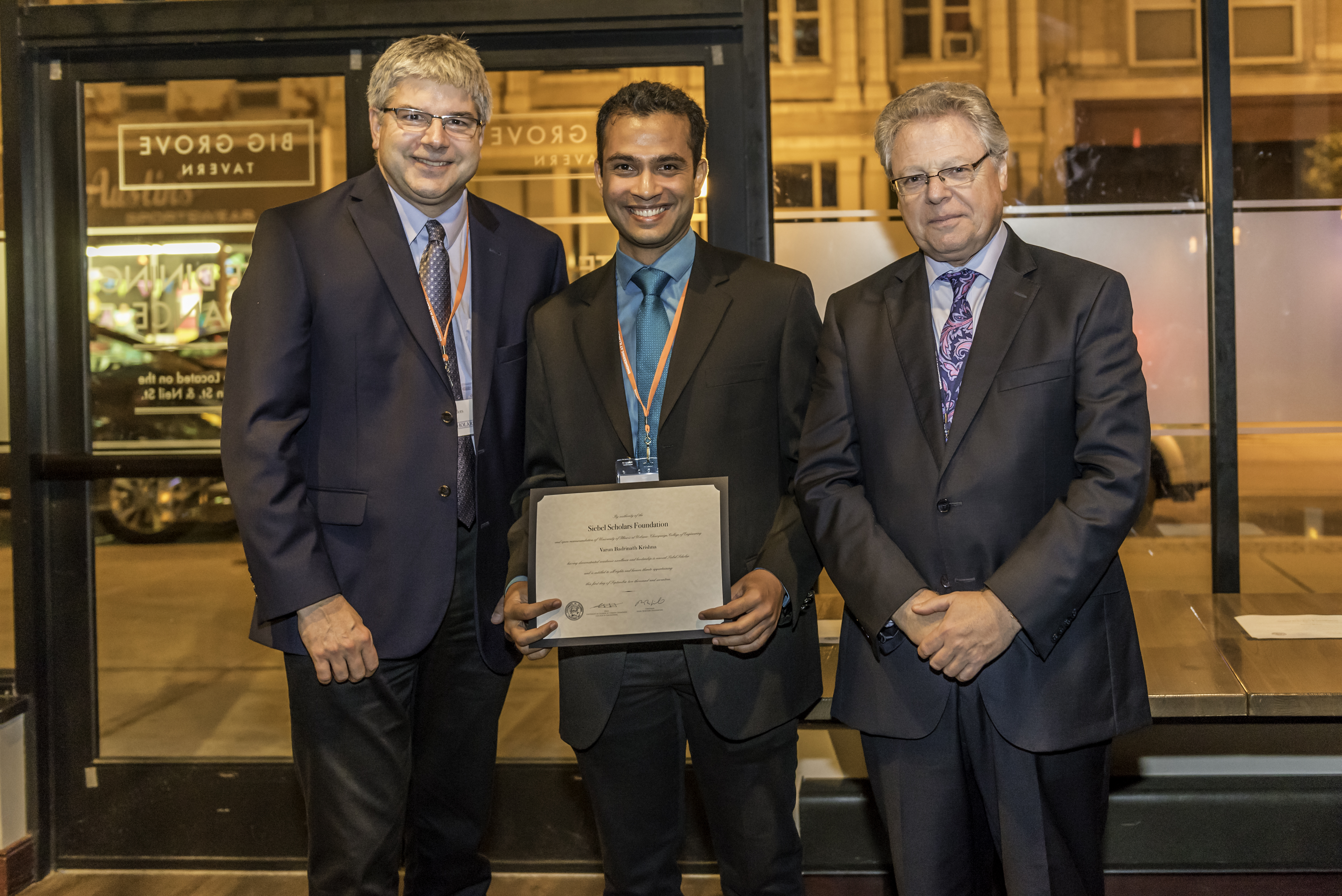 Krishna (center) with ECE Department Head William H. Sanders and Dean of Engineering at Illinois Andreas Cangellaris.