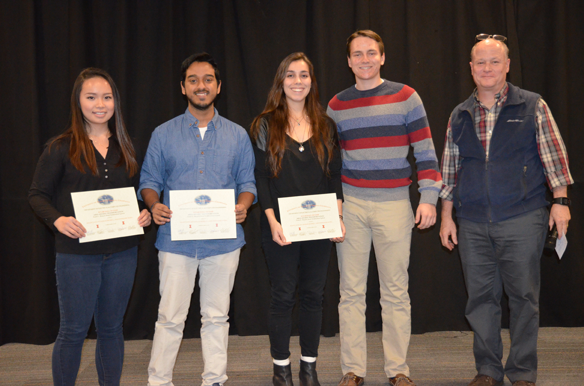 'Bicycle Street Notification System' received the Area Award for Transportation. Team members are Anant Jani, Savannah Russell, and Stephanie Wong. Also pictured are TA Channing Philbrick and Professor Reinhard.