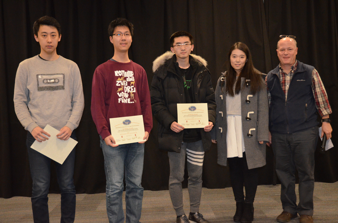 'Low Cost Solution of Thermal Cycler for LifeFoundry, Inc.,' was presented the Area Award for Interdisciplinary Work. The team includes Pei Liu, Shaoyu Meng, and Yuanjiu Hu, who are pictured with TA Xinrui Zhu and Professor Reinhard.