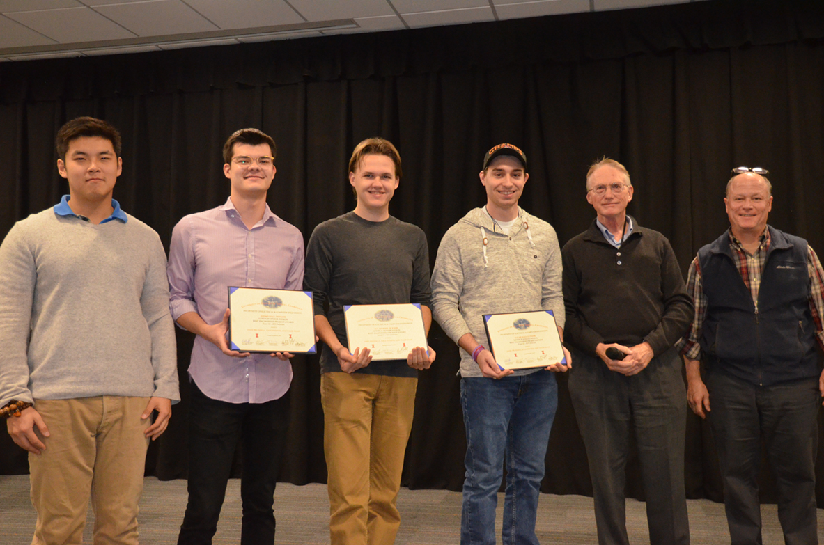 The Lextech Senior Design Best Engineered Project Award was also presented to 'RFI Detector.' The team includes Jamie Brunskill, Kyle Stevens, and Tyler Shaw, pictured with TA Zipeng Wang, and Professors Fliflet and Reinhard.