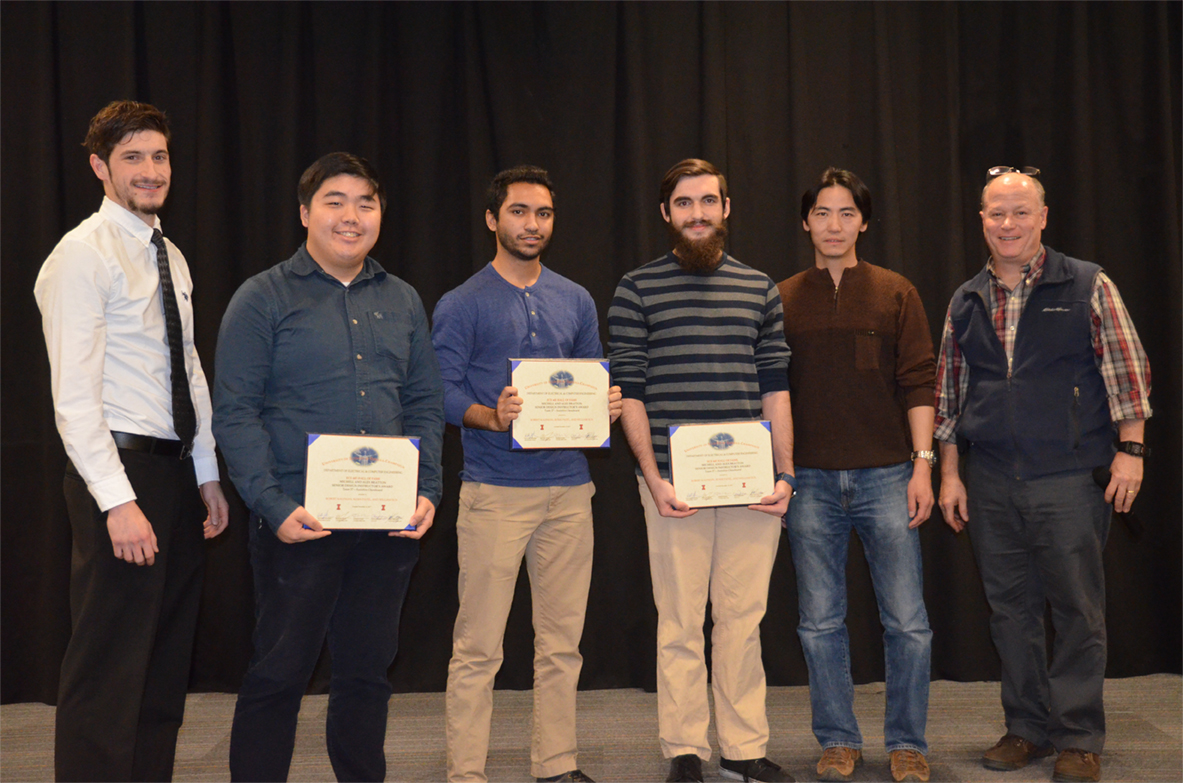 'Assistive Chessboard' won The Michelle and Alex Bratton Senior Design Instructor's Award. The team includes Robert Kaufman, Rushi Patel, and William Sun, who are pictured with TA John Capozzo and Professors Chen and Reinhard.