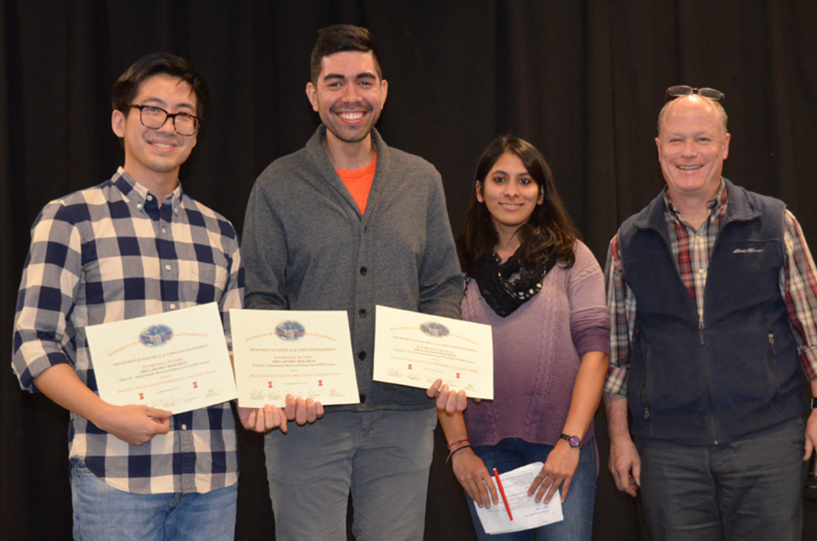 'Autonomous Motorized Mount for PATHS Sensor' won the Research Area Award. Team members include Brandon Bogue, Marvin Hernandez, and Quoc Pham. TA Yamuna Phal and Professor Reinhard are pictured as well.