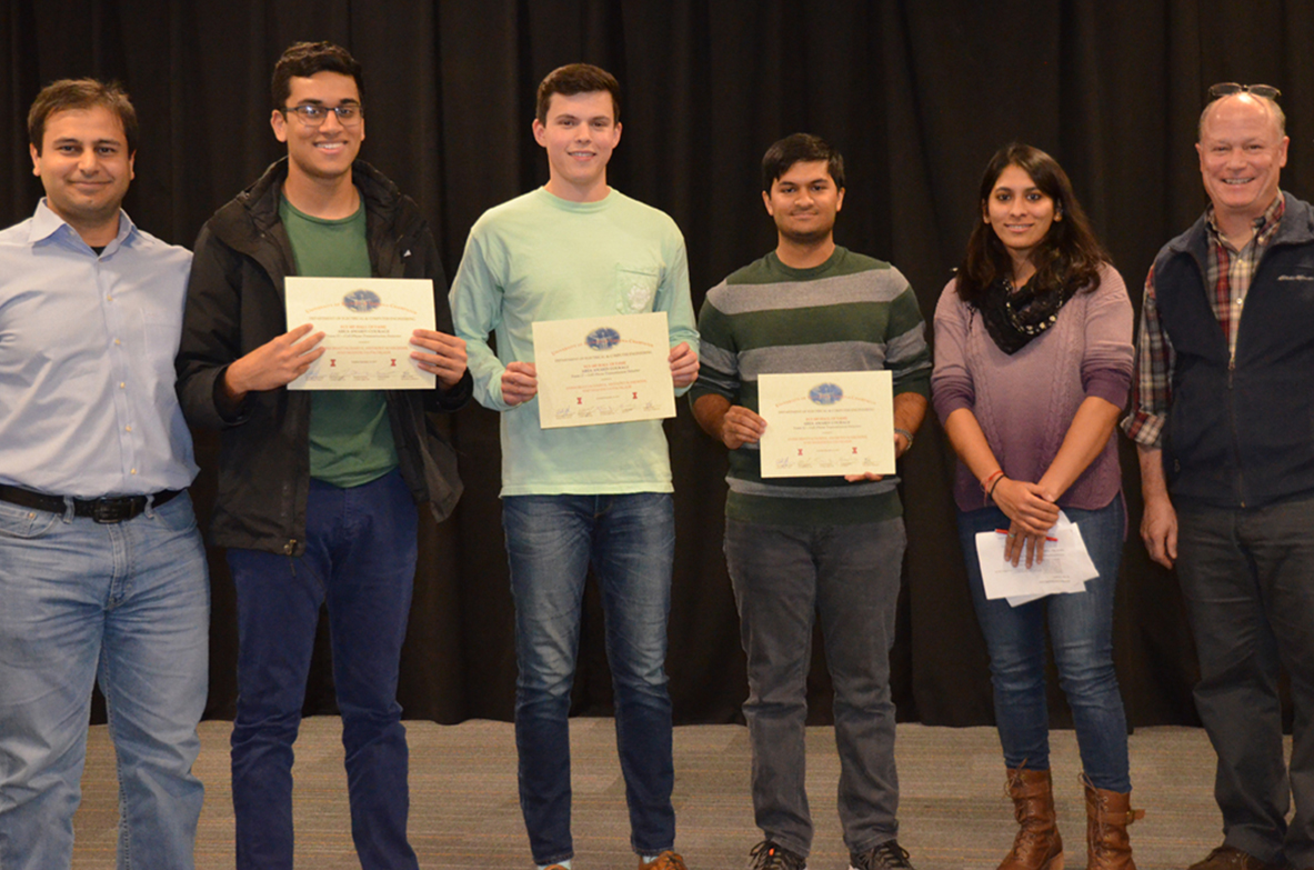 'Cell Phone Transmission Detector' won the Courage Area Award. The team includes Anish Bhattacharya, Anthony Schroeder, and Shandilya Pachgade, pictured with TA Yamuna Phal and Professors Bayram and Reinhard.