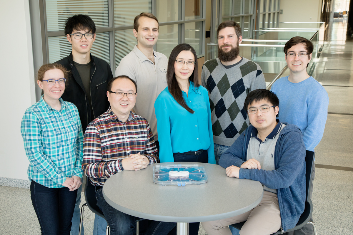 Front row from left, Kathy Walsh, Wen Huang, Xiuling Li and Jingchao Zhou; second row from left, Siyu Liu, Julian Michaels, Paul Froeter and Mark Kraman. [cr][lf][cr][lf]Photo by L. Brian Stauffer