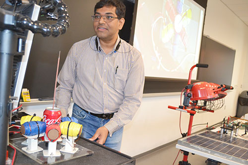 ECE ILLINOIS Assistant Professor Arijit Banerjee does a power demo for the educators.