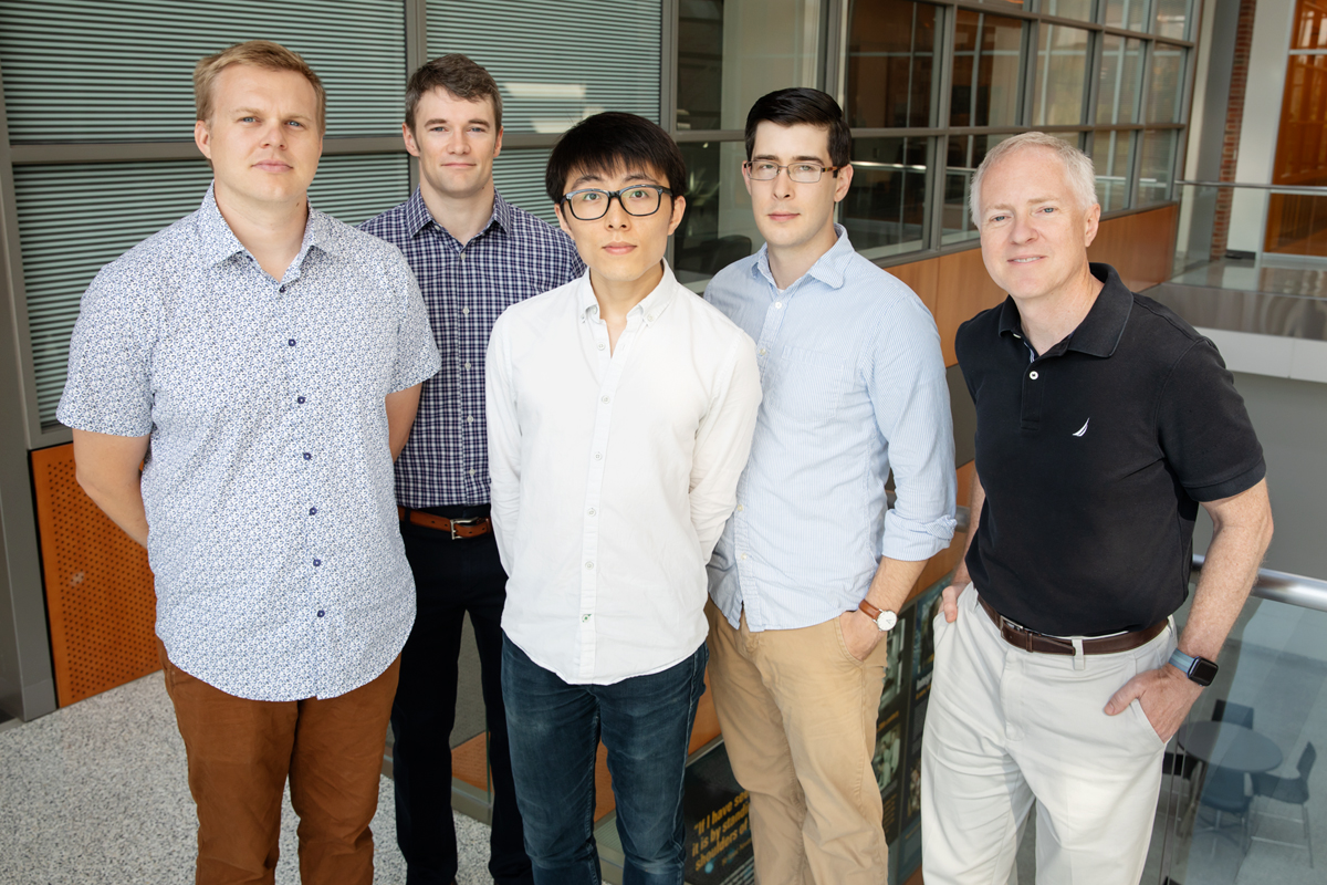 Illinois researchers developed a method to detect cancer markers called microRNA with single-molecule resolution, a technique that could be used for liquid biopsies. From left: postdoctoral researcher Taylor Canady, professor Andrew Smith, graduate student Nantao Li, postdoctoral researcher Lucas Smith and professor Brian Cunningham. (Photo credit to Illinois IGB)